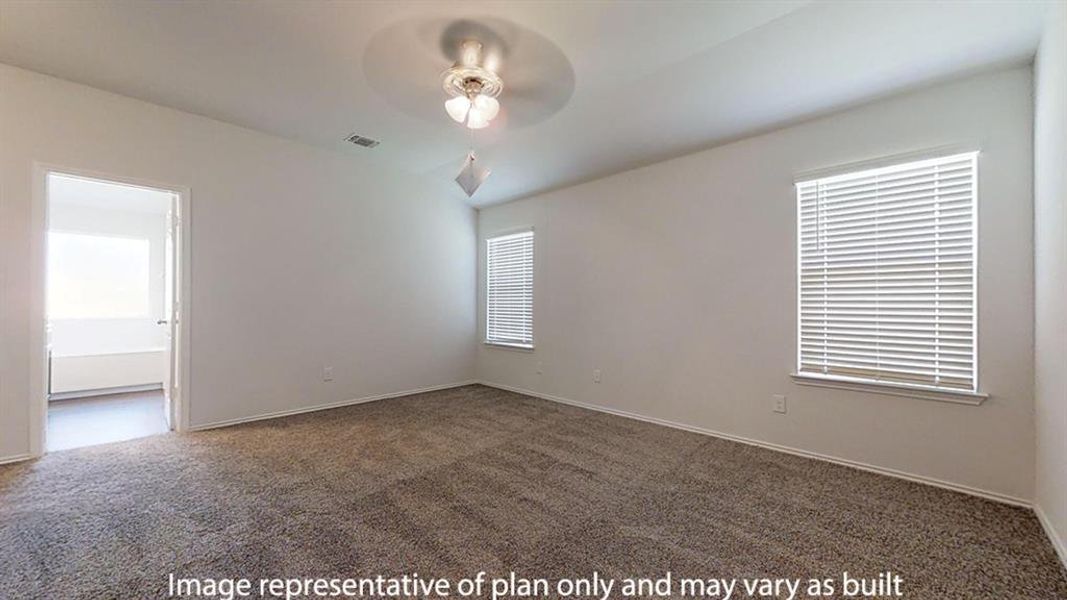 Empty room featuring carpet floors and ceiling fan Empty room featuring carpet floors and ceiling fan