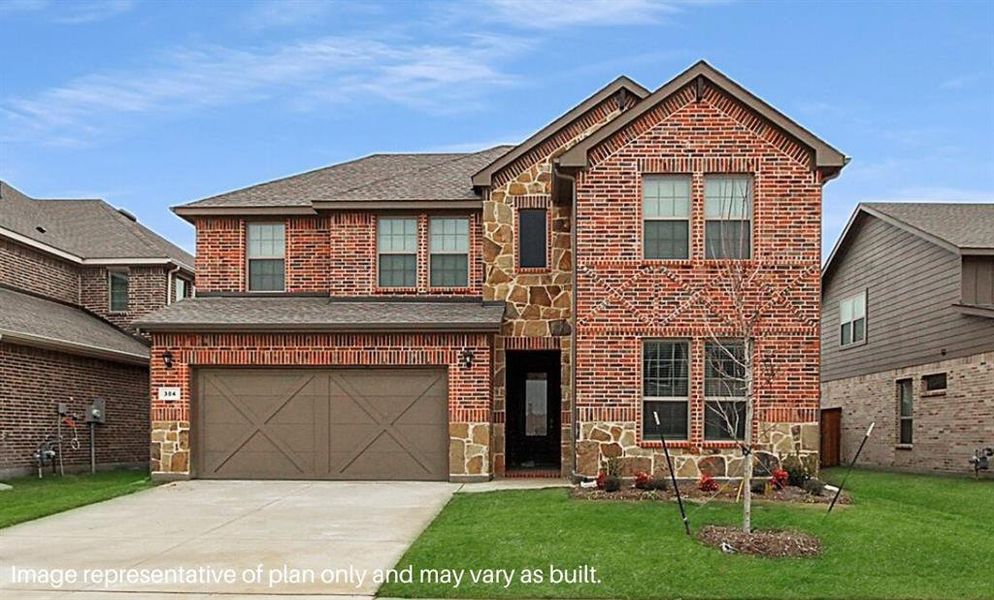 Front of property featuring a front yard and a garage