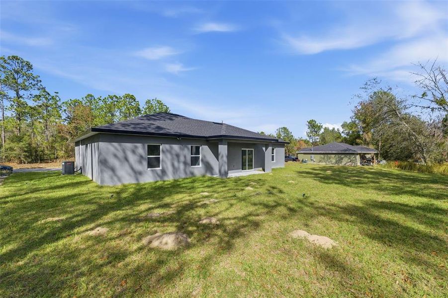Exterior details and patio area of a home in , Citrus Springs (Image 4).