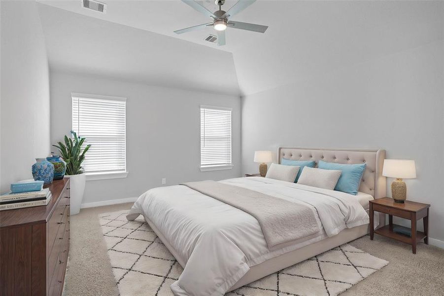 What a wonderful place to come home to, this stunning primary suite greets you with plush carpet flooring, a warm custom paint, high ceiling with ceiling fan, large windows with blinds allowing in natural light brightening up this spacious primary bedroom.