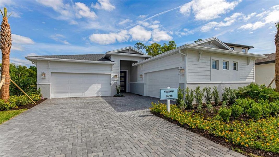 Front exterior of a new home in Cresswind DeLand, Deland, FL, highlighting curb appeal (Image 20). Front exterior of a new home in Cresswind DeLand, Deland, FL, highlighting curb appeal (Image 20).
