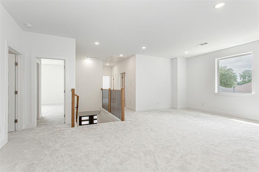 Carpeted spare room with attic access, recessed lighting, a smoke detector, and baseboards