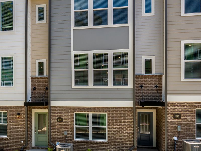 Exterior details and patio area of a home in Central Living at Craig, Charlotte (Image 3).