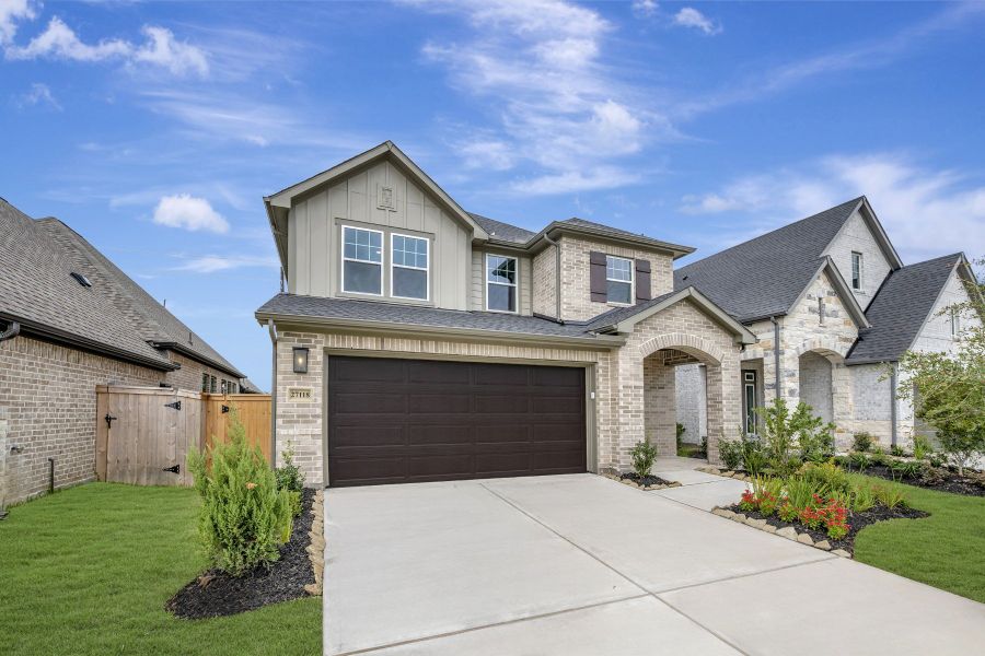 Front exterior of a new home in The Grand Prairie - Meadow Collection, Hockley, TX, highlighting curb appeal (Image 2). Front exterior of a new home in The Grand Prairie - Meadow Collection, Hockley, TX, highlighting curb appeal (Image 2).
