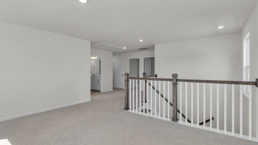 Representative unfurnished interior of a home built from the NORMAN by D.R. Horton in Eagle Creek, Fuquay Varina (Image 13).