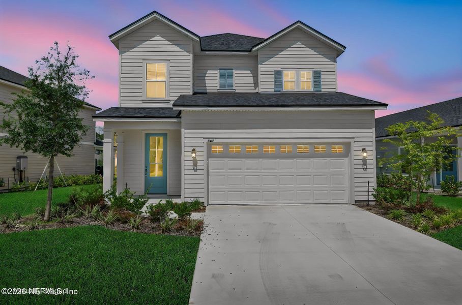 Front exterior of a new home in TrailMark, St. Augustine, FL, highlighting curb appeal (Image 31). Front exterior of a new home in TrailMark, St. Augustine, FL, highlighting curb appeal (Image 31).
