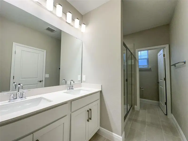 Furnished interior view inside a new home in Silverleaf Reserve Bungalows, Winter Garden (Image 8).