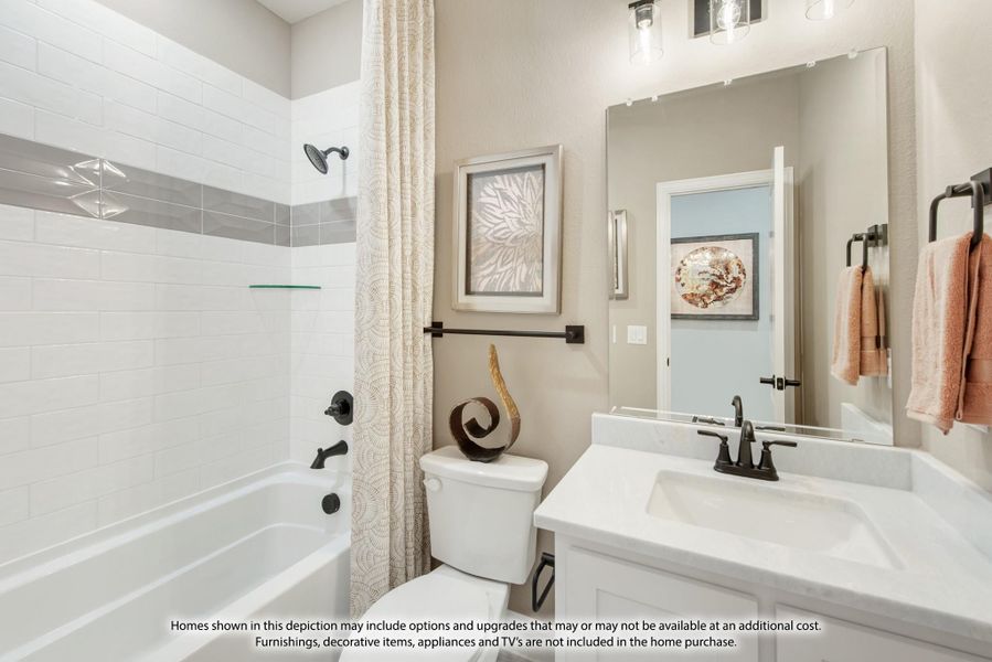 Bathroom with white tile tub-shower combo, single vanity, and large mirror with modern fixtures Bathroom with white tile tub-shower combo, single vanity, and large mirror with modern fixtures