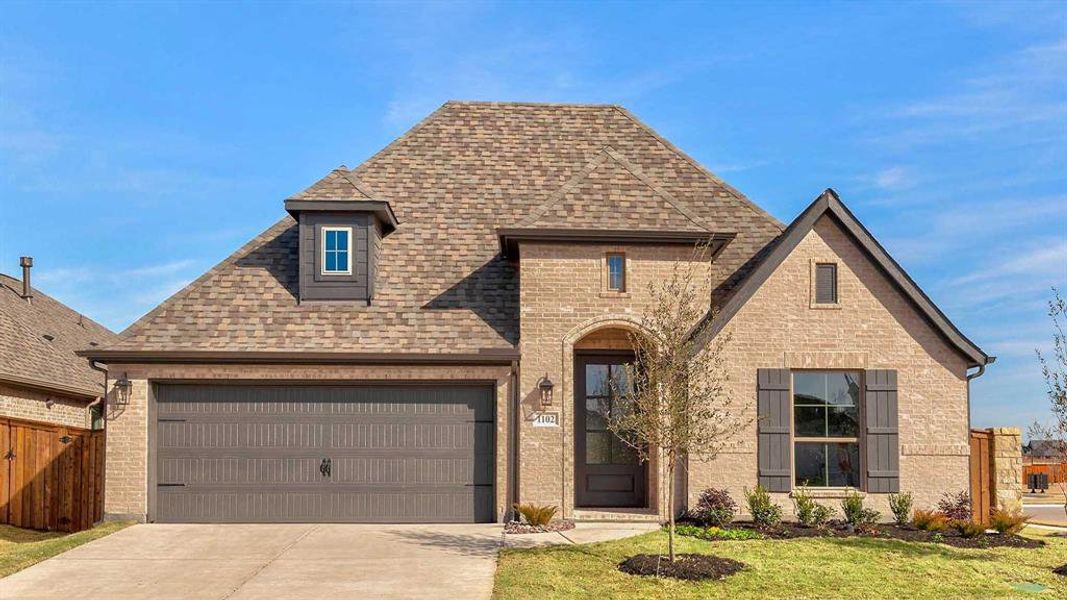 Front exterior of a new home in Devonshire - Reserve 50', Forney, TX, highlighting curb appeal (Image 1). Front exterior of a new home in Devonshire - Reserve 50', Forney, TX, highlighting curb appeal (Image 1).
