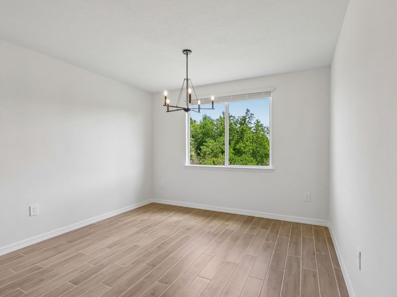 Spacious, unfurnished interior of a new home in The Grove at Stuart Crossing - Signature Series, Bartow (Image 9).