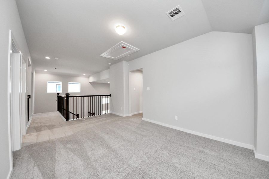 Ascend to relaxation in this fantastic game room! Ideal for both casual gatherings and adult gaming, it boasts plush carpet, lofty ceilings, custom paint, and ample windows for abundant natural light. Sample photo of completed home with similar floor plan. Actual colors and selections may vary. Ascend to relaxation in this fantastic game room! Ideal for both casual gatherings and adult gaming, it boasts plush carpet, lofty ceilings, custom paint, and ample windows for abundant natural light. Sample photo of completed home with similar floor plan. Actual colors and selections may vary.