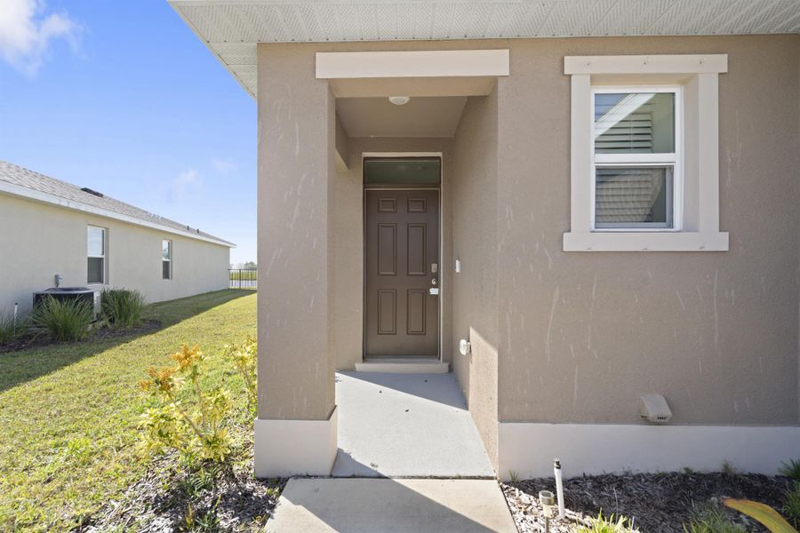 Exterior details and patio area of a home in Central Park 40s, Port St. Lucie (Image 21).