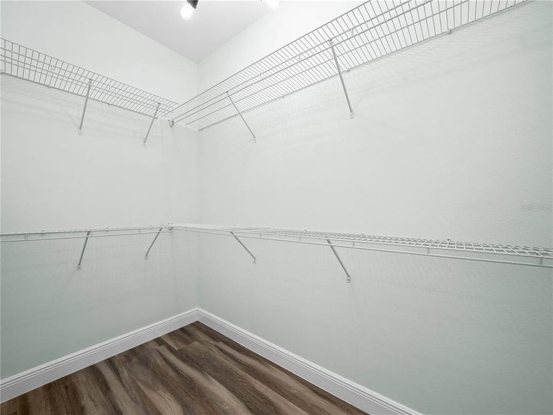 Primary bedroom walk in closet #1