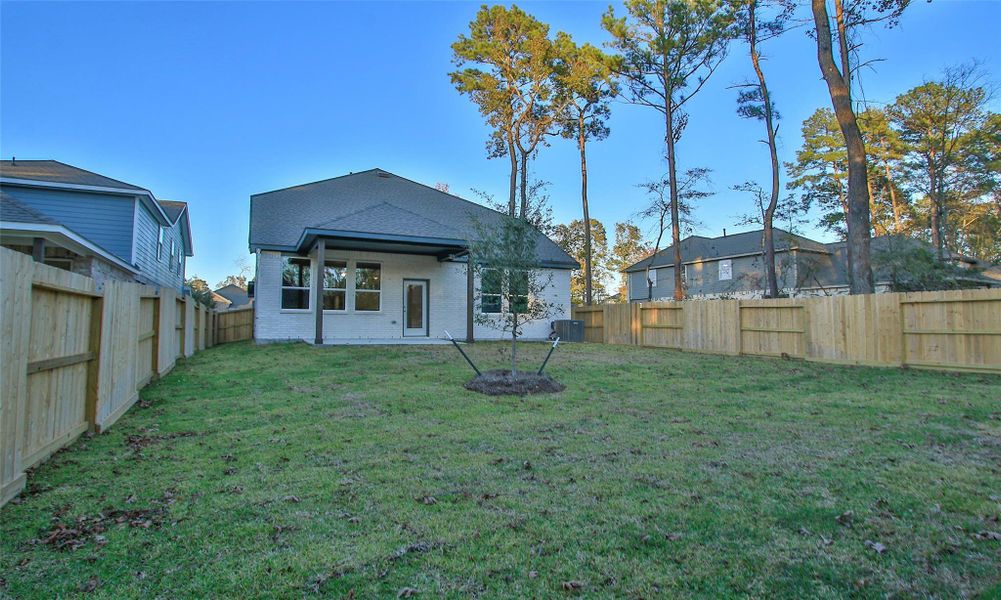 Exterior details and patio area of a home in The Woodlands Hills, Willis (Image 17). Exterior details and patio area of a home in The Woodlands Hills, Willis (Image 17).