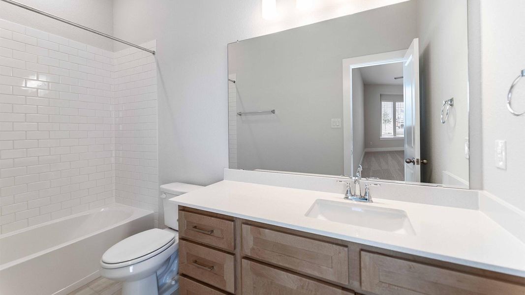 Bathroom featuring shower / washtub combination and vanity Bathroom featuring shower / washtub combination and vanity