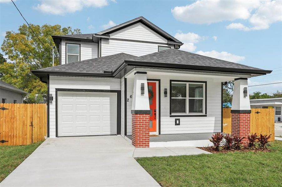 Front exterior of a new home in , Tampa, FL, highlighting curb appeal (Image 24).