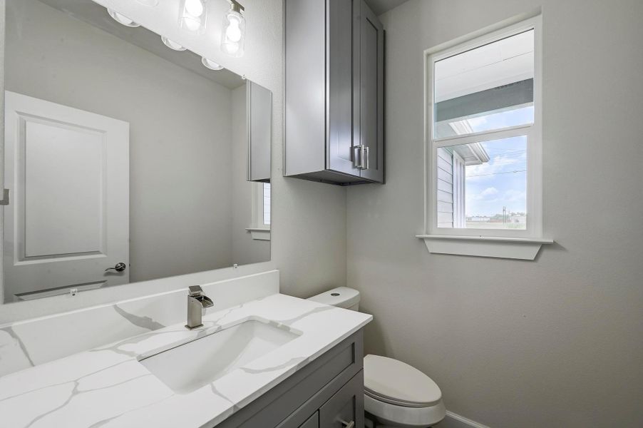 Bathroom with vanity and toilet