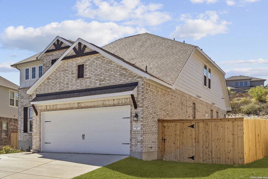 Front exterior of a new home in Ladera, San Antonio, TX, highlighting curb appeal (Image 2). Front exterior of a new home in Ladera, San Antonio, TX, highlighting curb appeal (Image 2).