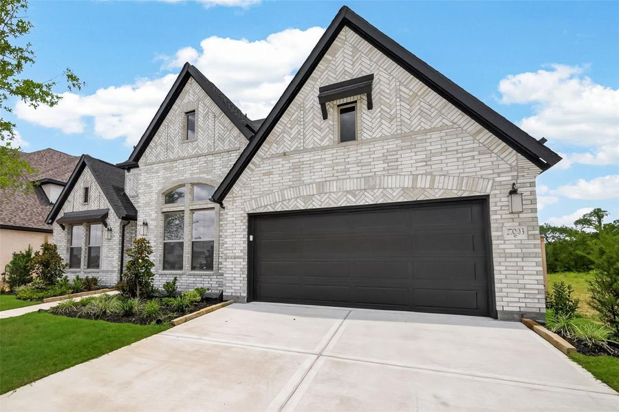 Front exterior of a new home in , Richmond, TX, highlighting curb appeal (Image 26).