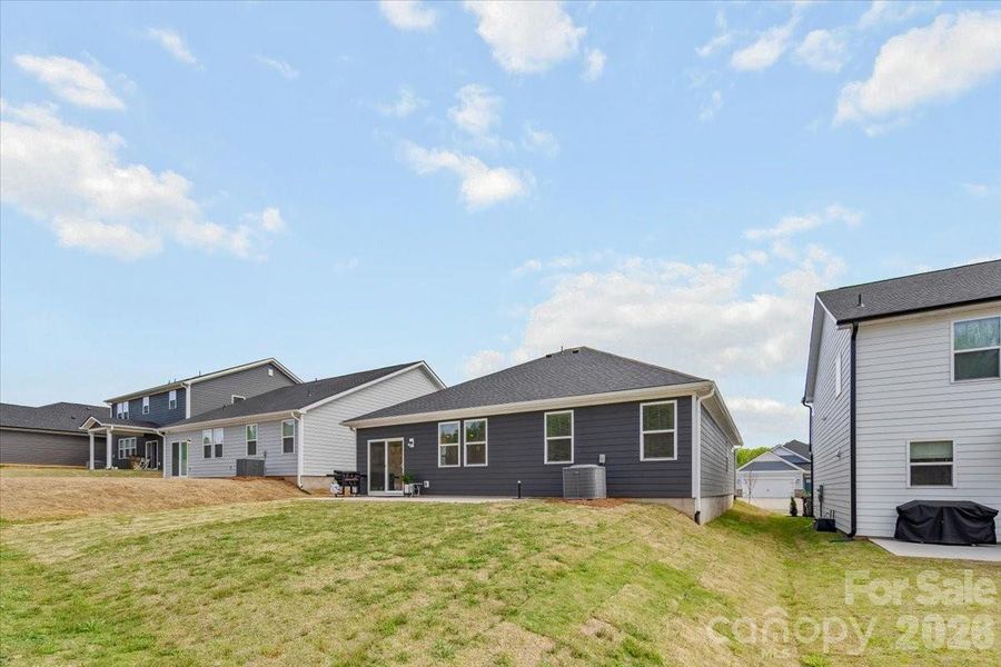 Exterior details and patio area of a home in Sheffield, Indian Trail (Image 25).