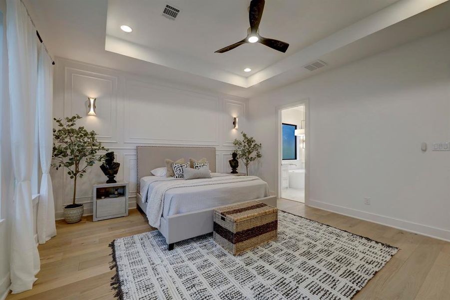 Accent wall, raised boxtray ceiling, wall sconces round out this tranquil space*photos are of a previously constructed home by the builder. 1406 Thornton may have different selections at builders sole discretion. These photos are not meant to be an exact representation of 1406 Thornton.