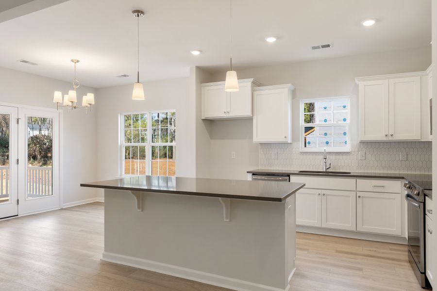 Furnished interior view inside a new home in Landing at Pine Lake, Anderson (Image 8).
