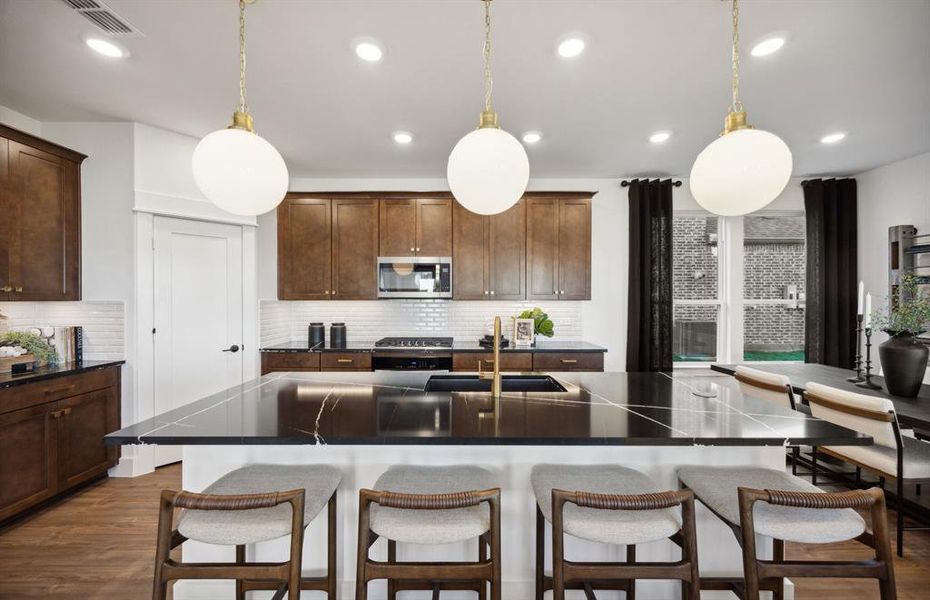 *Model Representation - Spacious kitchen with eat-in bartop island
