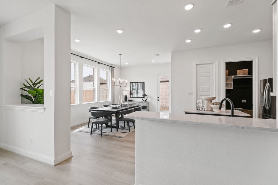 Representative furnished interior of a home built from the Premier Series - Mimosa by Brightland Homes in Anthem, Kyle (Image 12).