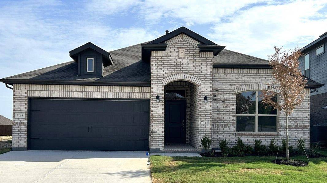 Front exterior of a new home in Bluestem, Rhome, TX, highlighting curb appeal (Image 1). Front exterior of a new home in Bluestem, Rhome, TX, highlighting curb appeal (Image 1).