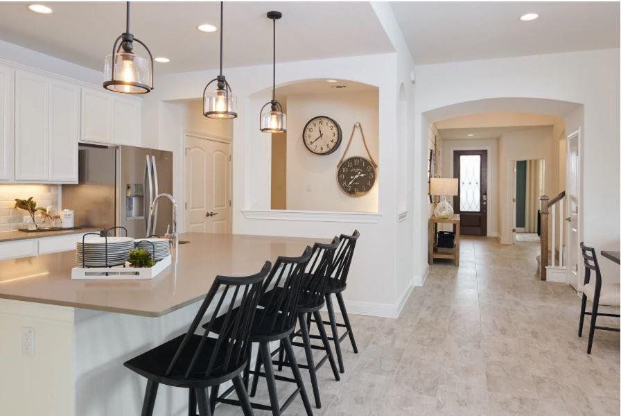 Photo of Pulte model home with same floor plan, not of actual home listed.