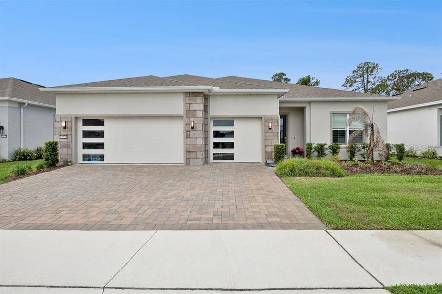 Front exterior of a new home in , Winter Garden, FL, highlighting curb appeal (Image 21).