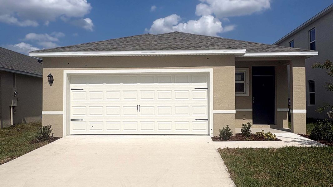 Front exterior of a new home in Campbell Crossing, Port Orange, FL, highlighting curb appeal (Image 1). Front exterior of a new home in Campbell Crossing, Port Orange, FL, highlighting curb appeal (Image 1).