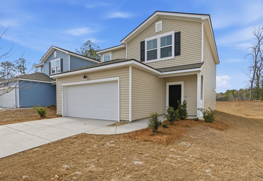 Front exterior of a new home in Grand Arbor, Blythewood, SC, highlighting curb appeal (Image 17). Front exterior of a new home in Grand Arbor, Blythewood, SC, highlighting curb appeal (Image 17).