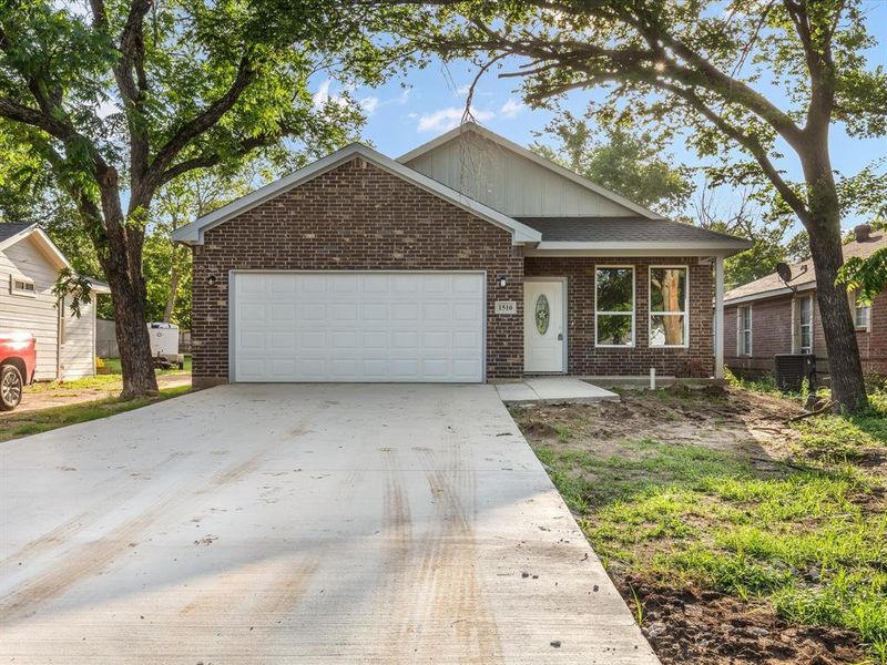 View of front of house featuring brick siding, a garage, and concrete driveway View of front of house featuring brick siding, a garage, and concrete driveway