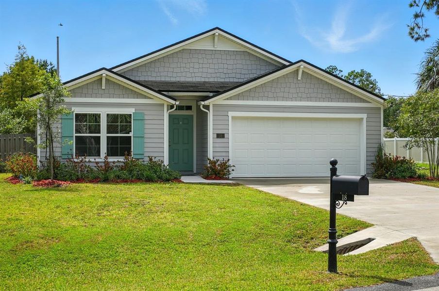 Front exterior of a new home in Palm Coast Homesites, Palm Coast, FL, highlighting curb appeal (Image 25).