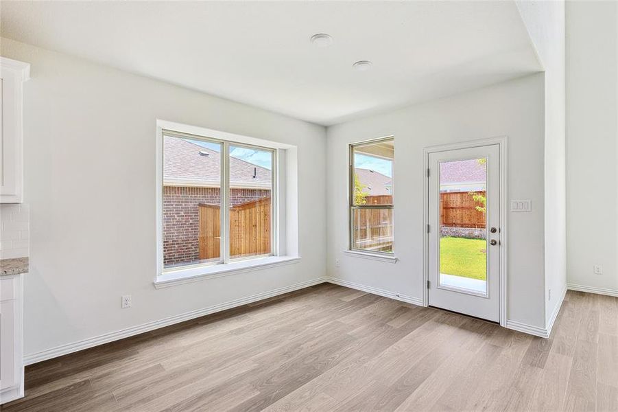 Doorway to outside with light hardwood / wood-style floors