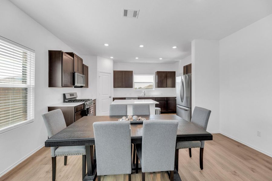Dining room featuring recessed lighting, visible vents, light wood-type flooring, and baseboards