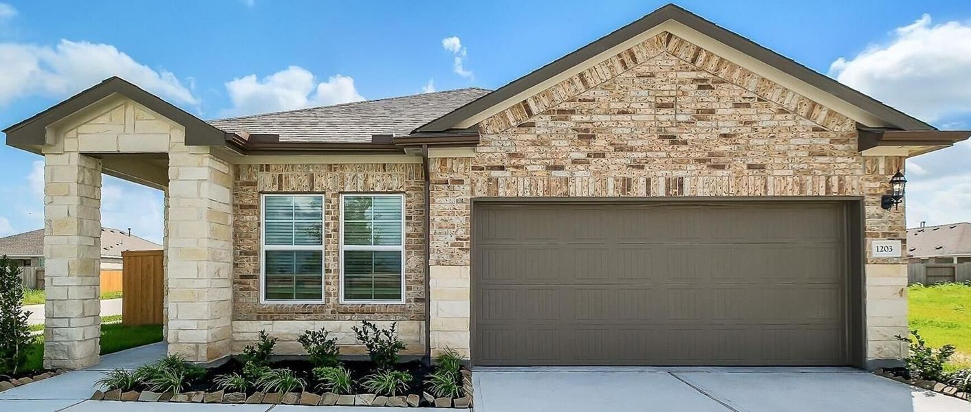 Front exterior of a new home in Emberly, Beasley, TX, highlighting curb appeal (Image 40).
