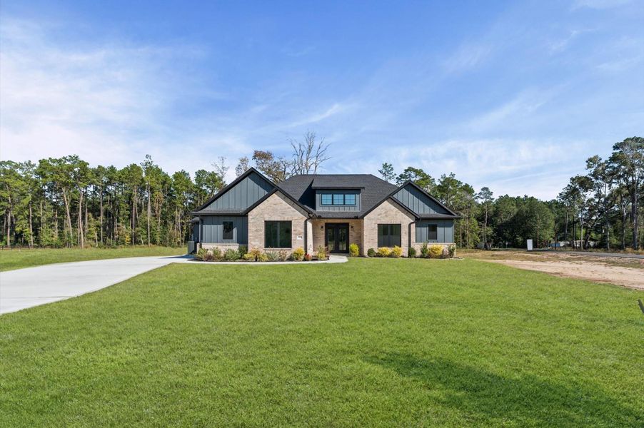 Front exterior of a new home in , Conroe, TX, highlighting curb appeal (Image 28).