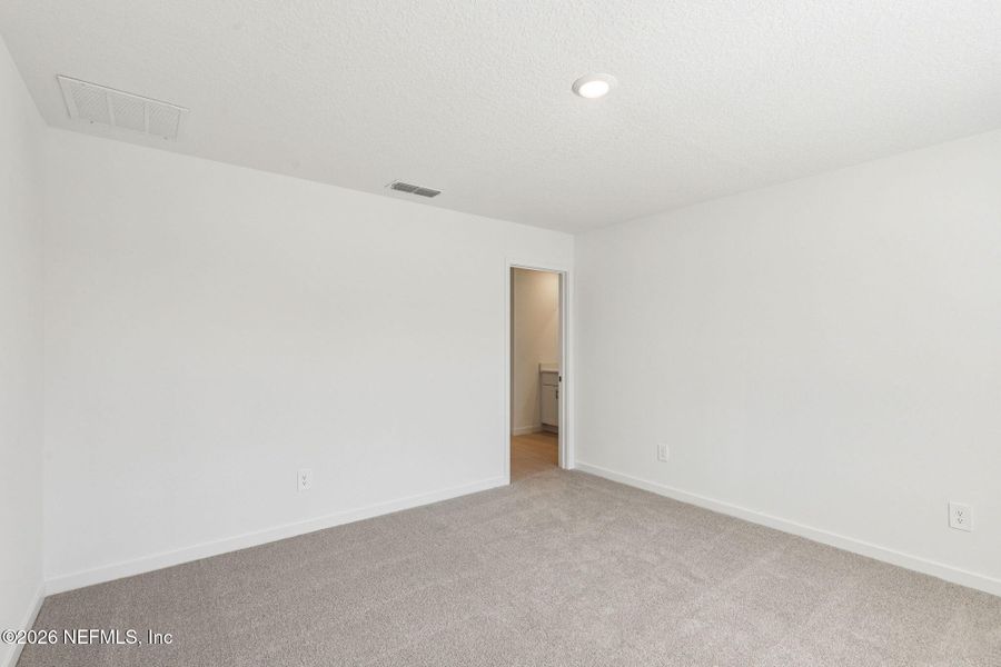 Spacious, unfurnished interior of a new home in Colbert Landings, Palm Coast (Image 28).