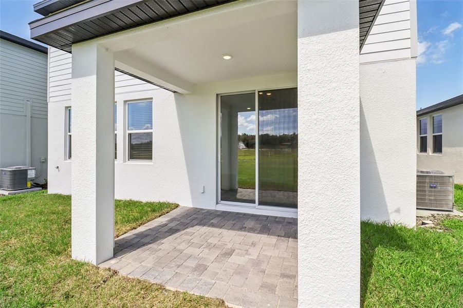 Exterior details and patio area of a home in The Reserve at Hammock Oaks - Classic Series, Lady Lake (Image 22).