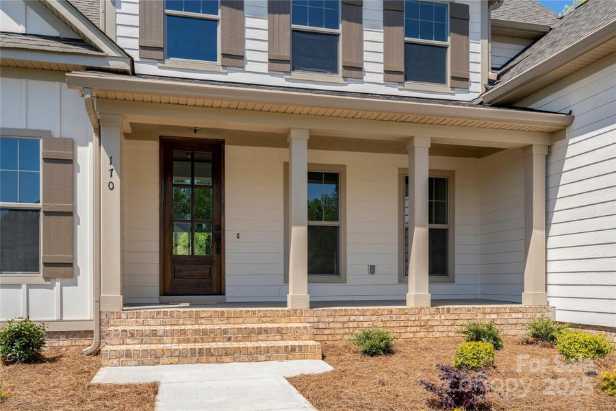 Please Note Photos are of completed home with similar finishes.   Plan to be reversed on this homesite