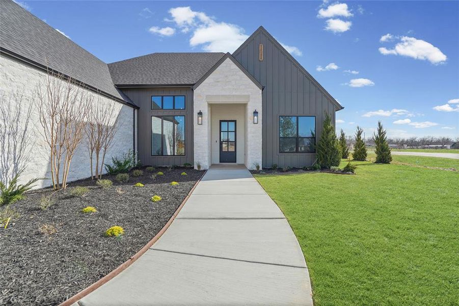 Front exterior of a new home in SouthBend Estates, Granbury, TX, highlighting curb appeal (Image 21).