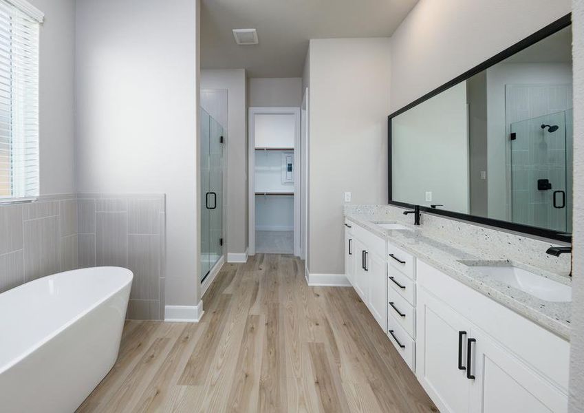 The master bath has it all, including a walk-in shower and a standalone tub.