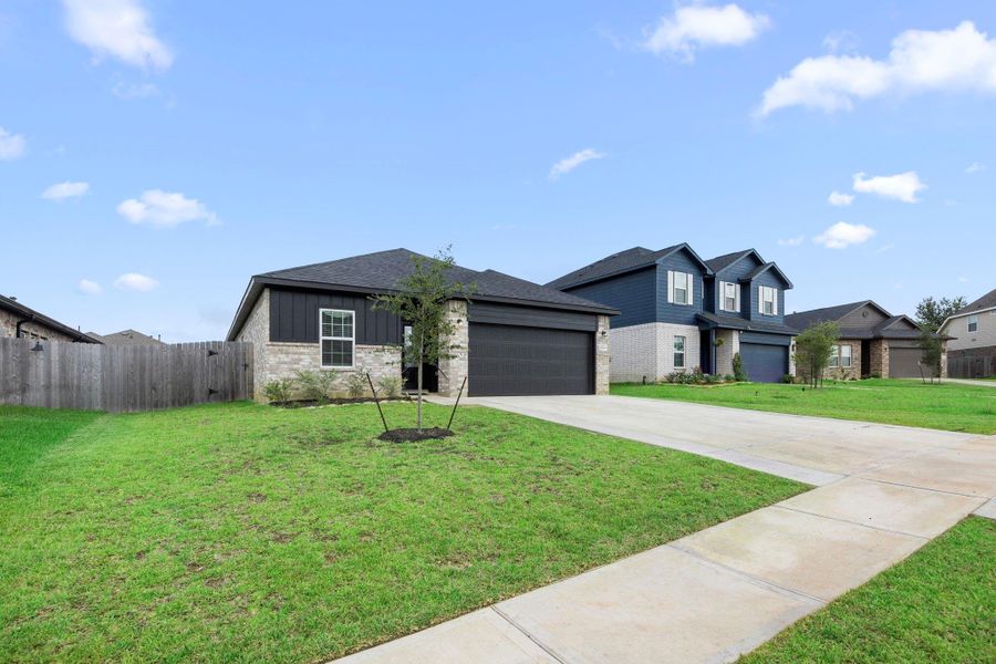 Front exterior of a new home in Glen Oaks, Magnolia, TX, highlighting curb appeal (Image 19). Front exterior of a new home in Glen Oaks, Magnolia, TX, highlighting curb appeal (Image 19).