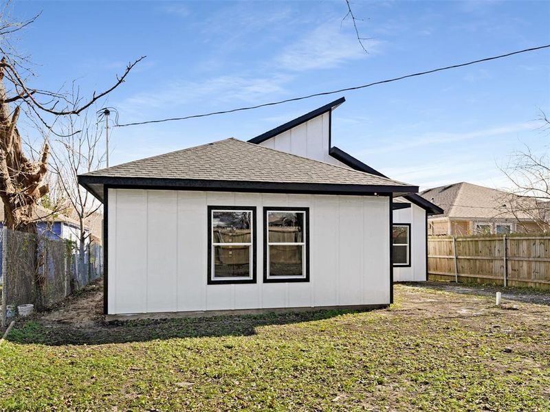 View of property exterior featuring a yard