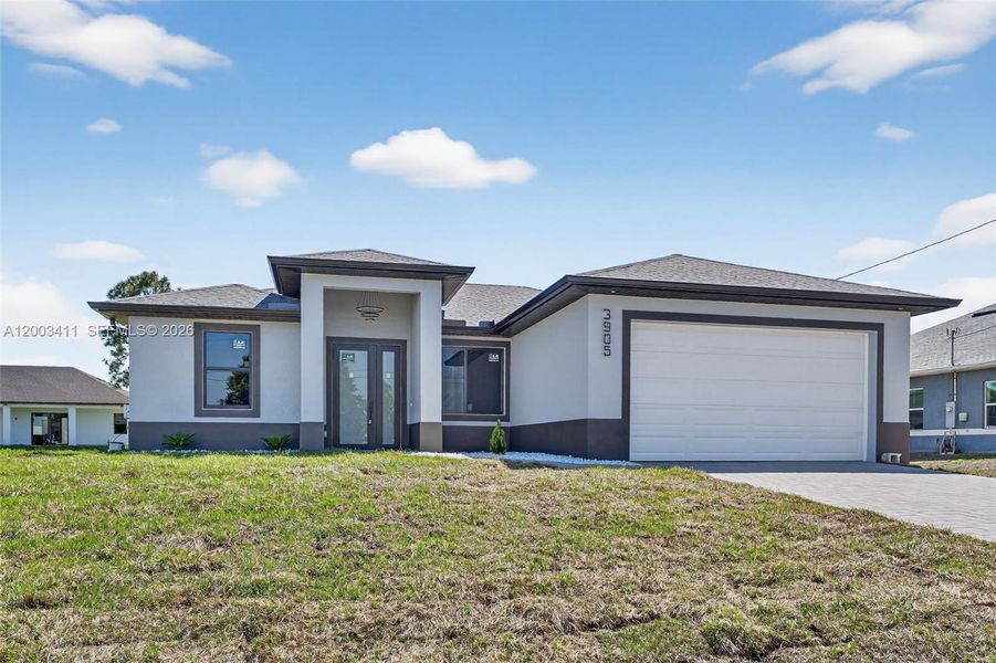 Front exterior of a new home in , Lehigh Acres, FL, highlighting curb appeal (Image 26).
