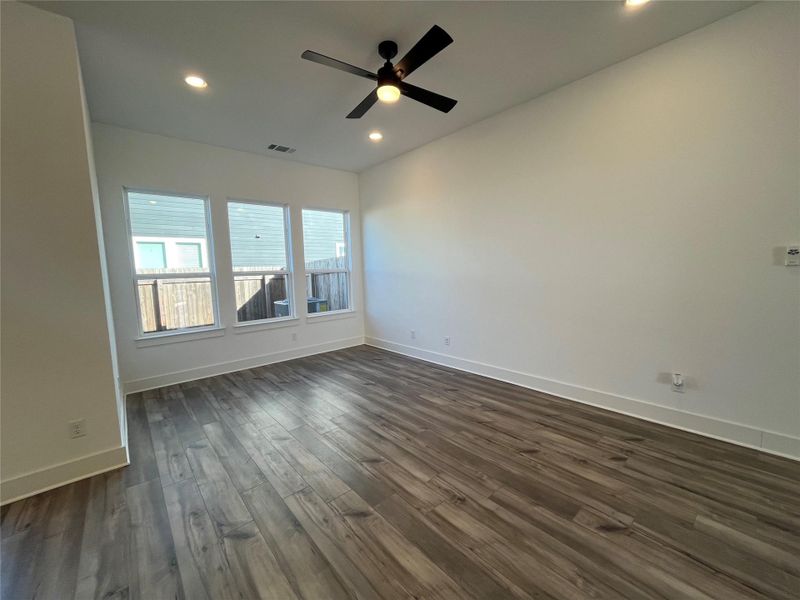 Family room with 3 large windows