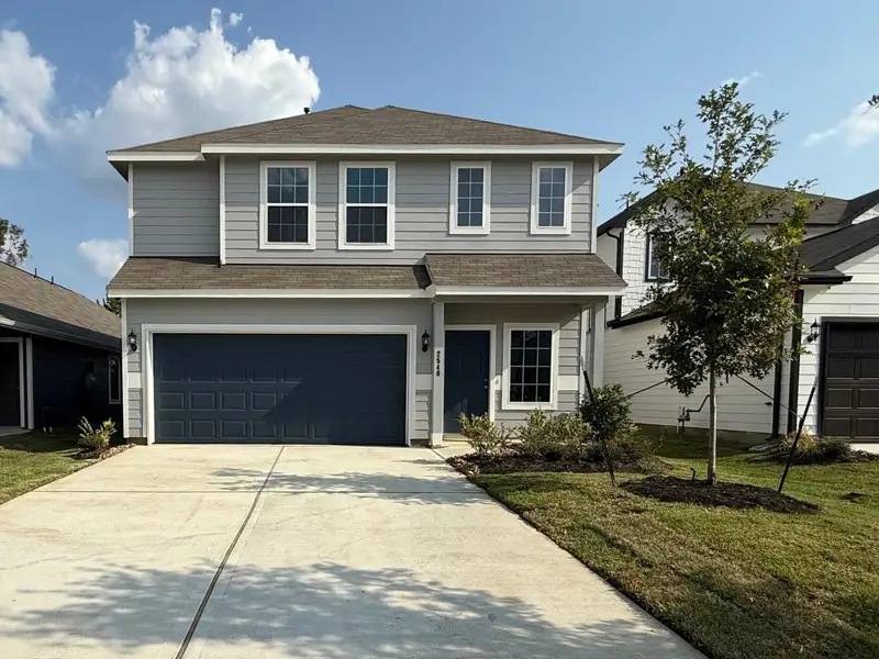 Front exterior of a new home in Cliffstone Hills, Conroe, TX, highlighting curb appeal (Image 1). Front exterior of a new home in Cliffstone Hills, Conroe, TX, highlighting curb appeal (Image 1).