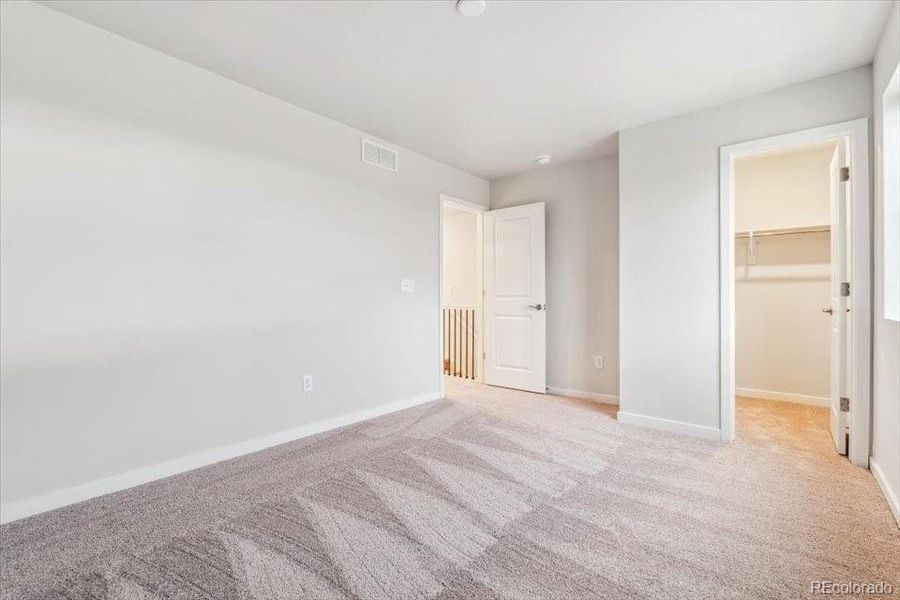 Spacious, unfurnished interior of a new home in The Haven II Collection  at Painted Prairie, Aurora (Image 18).